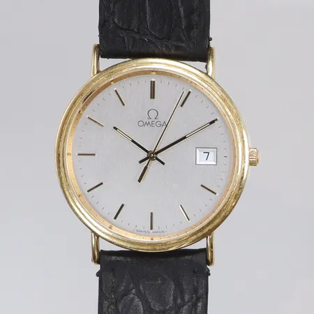 Herrur Omega 18K Ø33mm ref nr. 1967500 snr. 59871423, cal. 1530, ca år 1998, gravyr, med originalspänne, slitet läderband, guld i boetten, bruttovikt 34,3g 