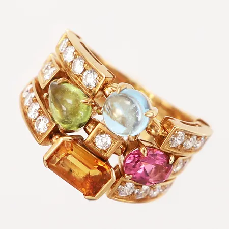 Ring, Bvlgari Allegra, stl17¼, delade skenor, med diamanter ca 20x0,03-,05ct, peridot, topaz och rosa granat. skenans bredd 5,3-14mm, 18K Vikt: 12,5 g