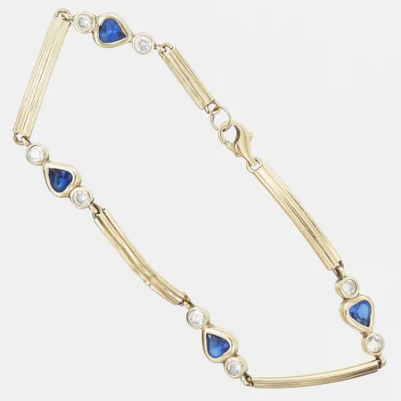 Armband med blå samt vita stenar, längd 19cm, bredd 6mm, bucklig/skadad länk, 14K guld Vikt: 5,2 g