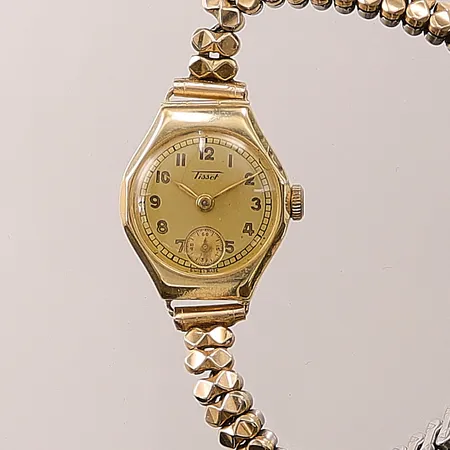 Damur Tissot 14K 21mm, manuell, slitet flexband.