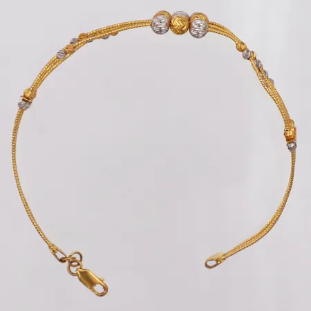 Armband, halvstelt, lås, ca 60 x 65mm, kulor gul/vitguld, skevt, 22K Vikt: 13,5 g