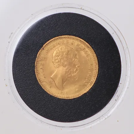 Mynt 10 kronor, Oscar II, präglad år 1874, plastetui, 21,6K Vikt: 4,5 g