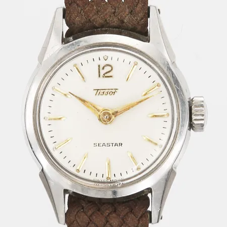 Damur Tissot Seastar, quartz, stål, Ø23mm, plexiglas, spänne i gulfärgad metall, brunt tygarmband, bruksslitage, repor på glas samt boett, tygfodral. 