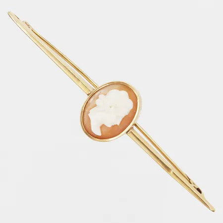Brosch med camé, längd: 7cm, bredd: 2-17mm, mindre ojämnheter, 18K guld, bruttovikt: 3,9g. 