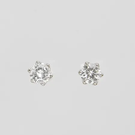 Enstensörhängen, diamanter 2 x ca 0,23ct, ca W/VS, vitguld, omaka snurrebussar varav en i rött guld, 18K Vikt: 1 g