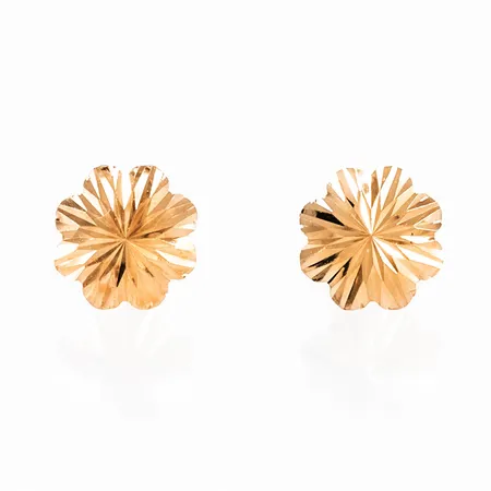 Örhängen i 18K guld: Fasetterad blomma Ø 8 x 8 mm. Vikt: 0,3g. Snurrebussar saknas, men nya i plast ingår. 