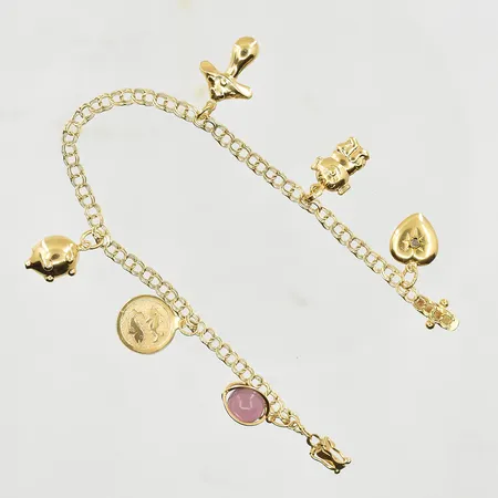 Armband Bismarck med 6 berlocker, längd 19 cm, länkens bredd 4 mm, 18K. Vikt: 8,5 g