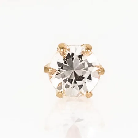 Ett udda örhänge i 18K guld. Vit sten Ø 4 mm. Vikt: 0,6g. 