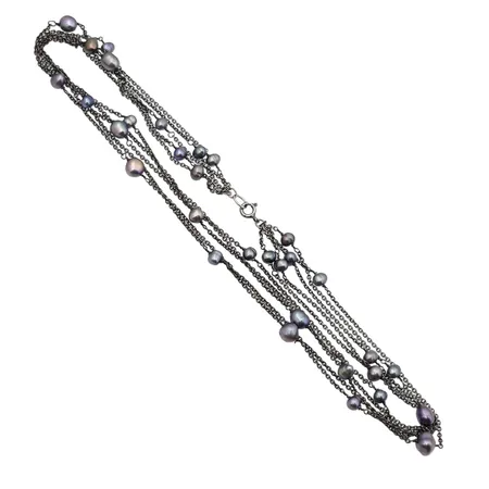 Pärlcollier, silver 925/1000, odlade sötvattenspärlor (pärlor med varierande mått, längd 8,5 mm och mindre), 4-radig modell, modell med mörkoxiderad silveryta, längd 44 cm, fint skick  Vikt: 21,9 g