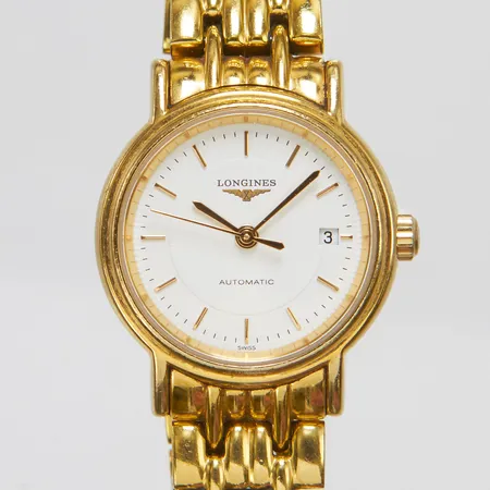 Damur, Longines Presence, Ø25,5mm, refnr: L4.221.2, serienr: 35072778, guld på stål, automatisk, datum, viklås, inga tillbehör.