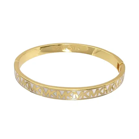 Armring, MICHAEL KORS, förgylld metall, öppningsbar, inre mått 17,0 cm, bredd 7 mm, mycket fint skick, vikt 24,2 gram