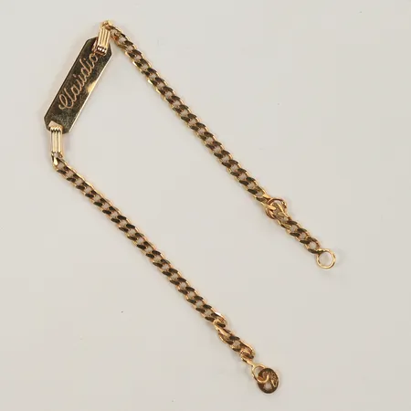 Armband med platta, längd 13cm, bredd 2-5mm, repig, 18K  Vikt: 1,9 g
