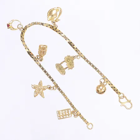 Armband Venezia med berlocker, 17,5cm, bredd 2mm, en av berlockerna är en bjällra som låter, 18K Vikt: 10,9 g