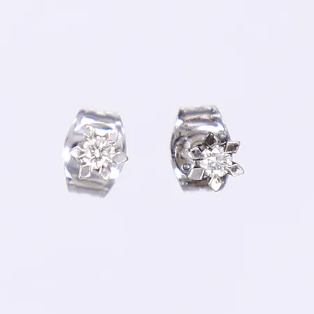 2 udda örhängen med diamanter 2x ca 0,05ct, vitguld 18K Vikt: 1,5 g