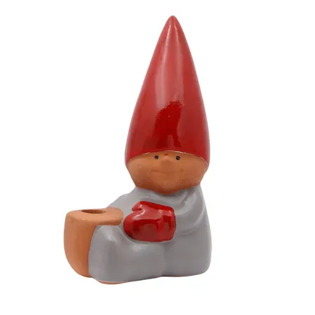 Figurin, Lisa Larson "Tomte", ljushållare, höjd 13,5 cm, bredd 6,5 cm, märkt med etikett "Lisa Larson Design", fint skick, vikt omkring 178 gram Skickas med paket.