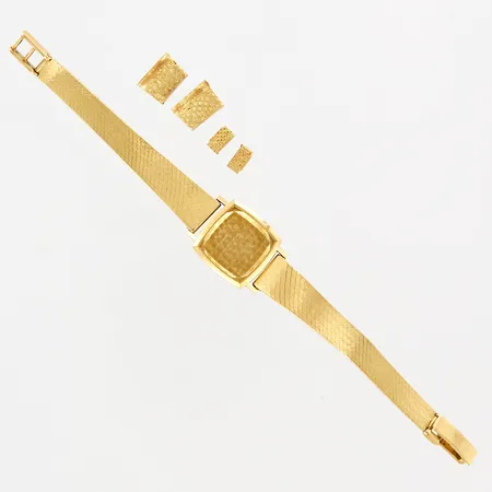 Boett med integrerat armband samt fyra lösa guldbitar, defekt, 18K Vikt: 31,2 g