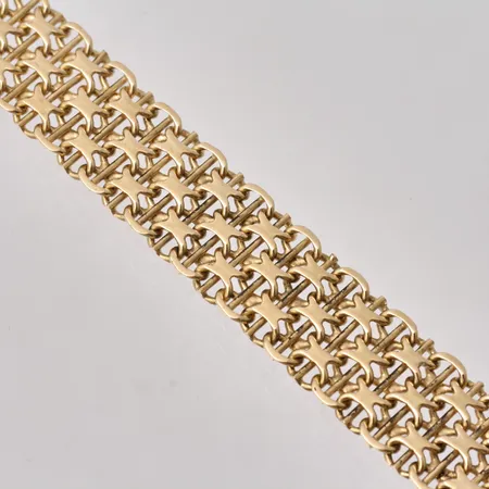 Armband i 18K guld, 18,7mm, X-länk med stav, bredd 12,6mm, tillverkad av Stockholms Ädelsmide Ab, vikt 25,43g.