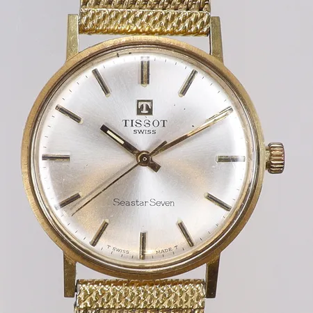 Herrur Tissot SeastarSeven Ø33,5mm 18K, manuell uppdragning, gravyr, med slitage, guldfärgad stållänk, bruttovikt 58,4g