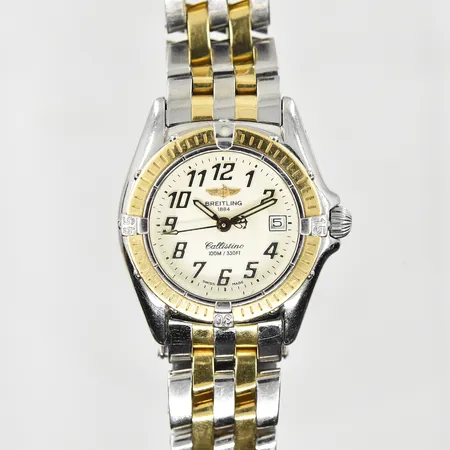Damur Breitling Callistino, boett Ø26 mm, quartz, datum, safirglas, serienr D52045.1, refnr 6267, pilotlänk, guld/stål, går ojämnt/ojämn sekundvisning, inga tillbehör. Vikt: 0 g