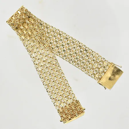 Armband X-länk med stav, längd 19½ cm, bredd 18 mm, ena lås åttan är något slapp vid låsning, 18K. Vikt: 31,8 g