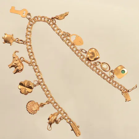 Armband Bismarck med elva berlocker, längd 18,5cm, bredd ca 4-22mm,  Vibergs Guldvaror Sture Viberg, år 1960, 18K Vikt: 14,1 g
