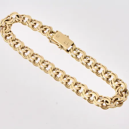  Armband i 18K guld, 18,5cm, Bismarck, bredd 7,3mm, importstämpel, vikt 18,66g.