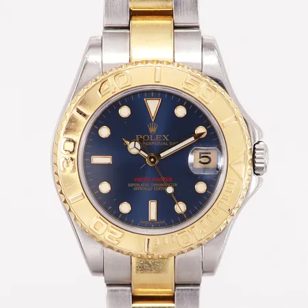 Armbandsur Rolex Yacht Master, Ø35mm, automatisk, datum, guld/stål med blå urtavala, Oysterlänk guld/stål, referensnr: 168623, kaliber:3235, serienr: Y266415, år: 2002, verknr:1153631, smärre repor på länk, inga tillbehör Vikt: 0 g