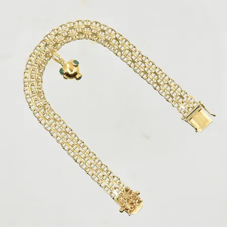 Armband X-länk med fast berlock, längd 18½ cm, bredd 8 mm, 18K. Vikt: 13,4 g