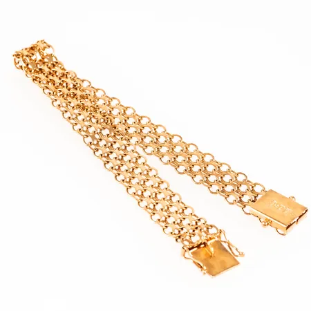 Armband X-länk i 18K guld. Det är 19 cm långt, 11 mm brett och väger 12,9g. Kistlås. Svag vridning i länken. 