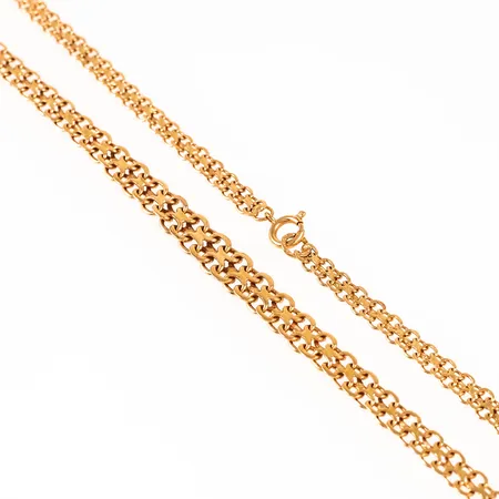 Collier x-länk i 18K guld. Den är 40,5 cm lång, 4,6 - 7,5 mm bred och väger 14,4g. Springring. 