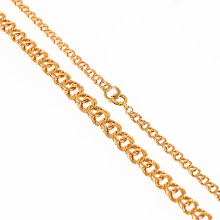 Collier bismarck i 18K guld. Den är 44 cm lång, 4 - 6,9 mm bred och väger 15,6g. Springring.