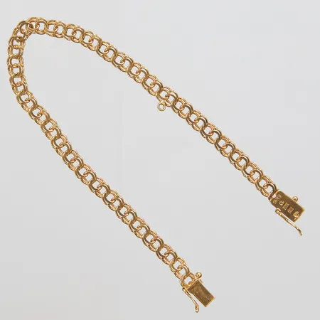 Armband, Bismarck, längd: 18,8cm, bredd: 4,6mm, en extra ögla för berlock fastlödd på länken, svenska stämplar, 18K Vikt: 7 g