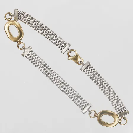 Armband, tvåfärgat, längd: 19,5 cm, bredd: 6 - 10 mm, 9K guld. Vikt: 7,1 g