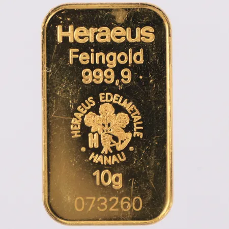 Guldtacka, Heraeu Feingold, längd 31,6mm, bredd 18,5mm, nr 073260, repor, 24K Vikt: 10 g