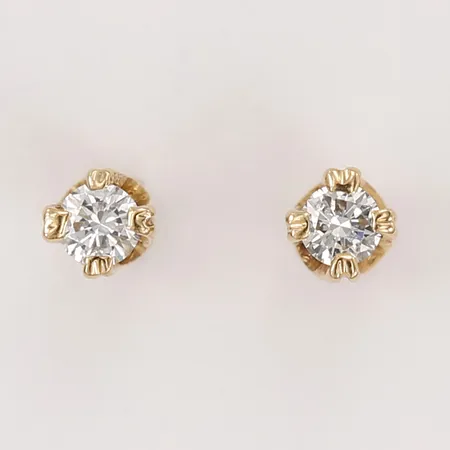 Ett par örhängen med diamanter totalt ca 0,06ct, saknar lås, 18K Vikt: 0,4 g