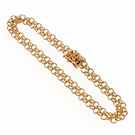 Armband, X-länk i 18K guld. Det är 18,5 cm långt, 5,5 mm brett och väger 6,0g. Kistlås. 