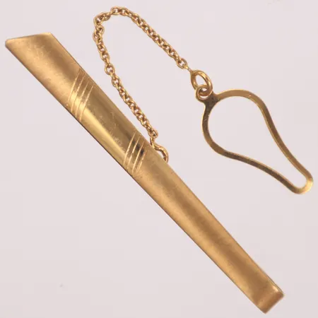 Slipshållare, längd 5,5cm, bredd 5mm, 18K  Vikt: 4,4 g