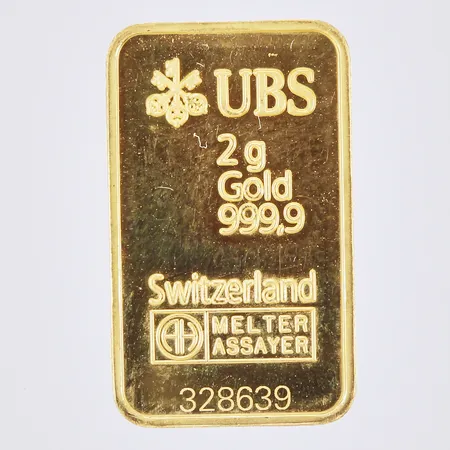 Guldtacka, UBS Switzerland, serienr: 328639, längd: ca 1,9cm, bredd: ca 11mm, 24K  Vikt: 2 g