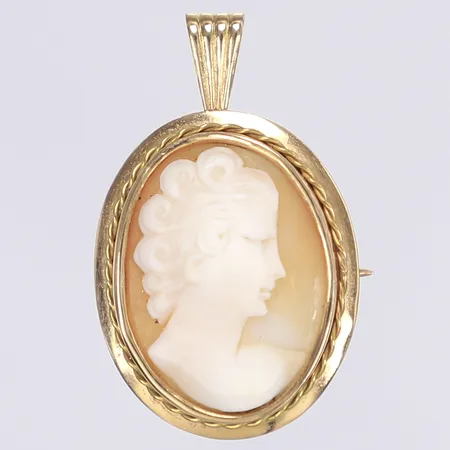 Hänge/Brosch med camé, 30x24mm exklusive ögla, svenska stämplar, 18K Bruttovikt: 5,7g Vikt: 5,7 g