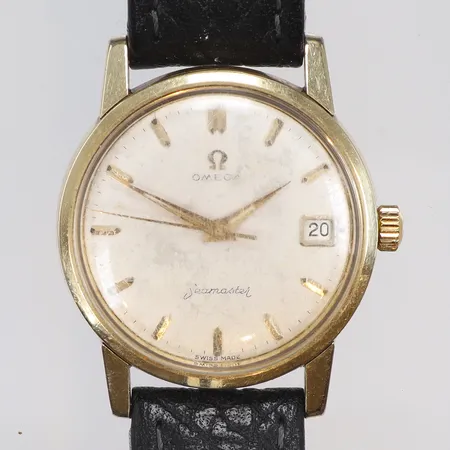 Herrur Omega Seamaster Ø33,5mm, ref nr. 14384-61-SC snr. 168991340 cal. 610, ca år 1958, manuell uppdragning, guld på stål, originalglas (ytliga repor), originalkrona, urtavla med slitage, slitet läderband 