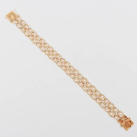 Armband vågigt/ojämnt, längd ca 18 cm, bredd 12 mm, 18k. Vikt: 22,2 g