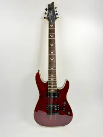 Elitarr, Schecter Omen-5 diamond series, Omen extreme 7, serienr 0614704, kropp i mahognyfärg, hals i lönnfärg med pärlemorinlägg, mjukt fodral. Skickas med postpaket.