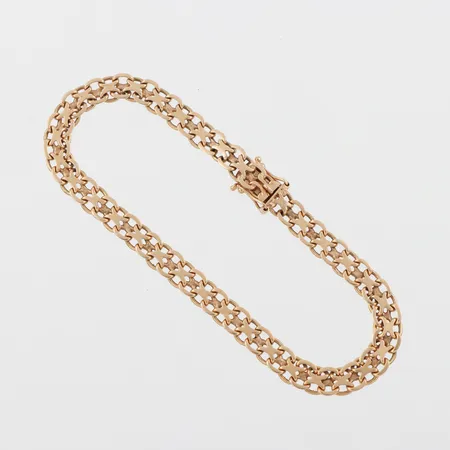 Armband X-länk, längd ca 19 cm, bredd 5.4 mm, 18k. Vikt: 9,3 g