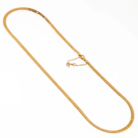 Halvstelt collier i 18K guld med facettslipad dekor i vitt guld. Det är 50 cm långt, 3,9 mm brett och väger 22,1g. Karbinhake och säkerhetskedja. Från Unoaerre. Stämplat 750.