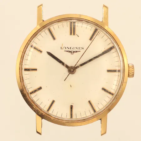 Armbandsur Longines 18K, manuell, 34mm, boettnr 18227874, repigt plexiglas och boett, skadad urtavla, gravyr, armband saknas, bruttovikt 27,5g 