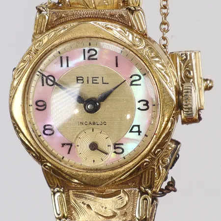 Damur Biel 18K Ø22mm, manuell uppdragning, helguld, integrerad länk, defekt i länken, bruttovikt 17,3g 