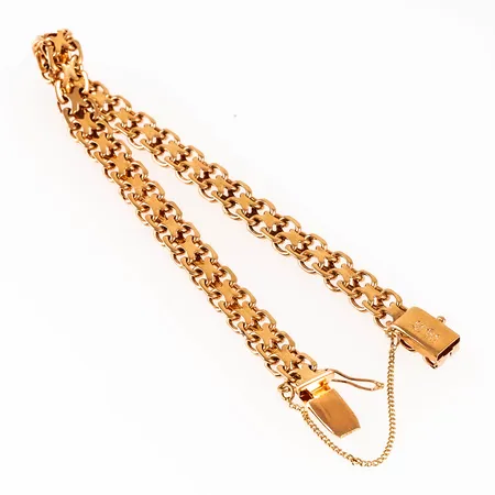Armband x-länk i 18K guld. Det är 18,5 cm långt, 6,2 mm brett och väger 13,9g. Kistlås & säkerhetskedja. 