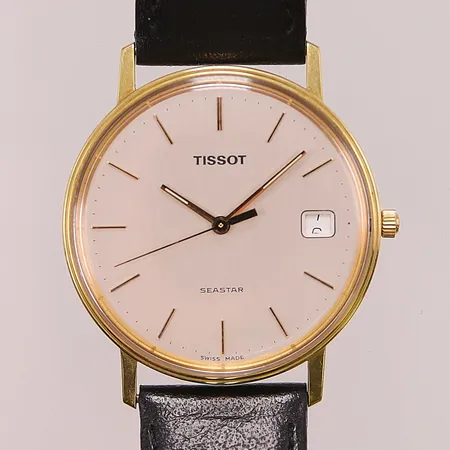 Herrur Tissot Seastar 18K, 33,5mm, quartz, graverad "För nit och redlighet i rikets tjänst", går ej.