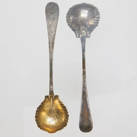 Två kompottskedar, längd ca 14cm, år 1884, förgyllt, 830/1000 silver Vikt: 30,7 g