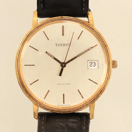 Armbandsur Tissot Seastar 18K, 33,5mm, quartz, datum, gravyr För nit och redlighet i rikets tjänst, repigt plexiglas och boett, går ej, behov av batteribyte, slitet läderarmband ej original, inga tillbehör, bruttovikt: 29,4g 